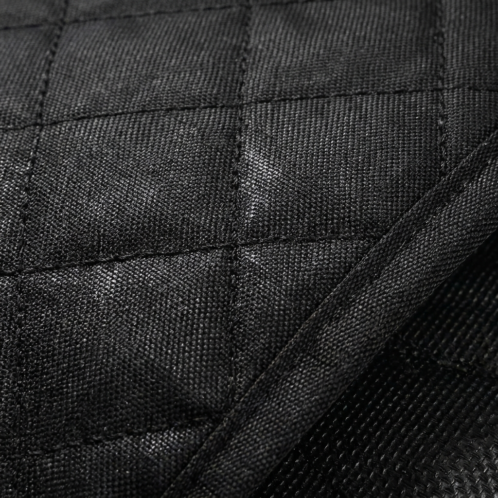 Close-up of waterproof oxford fabric texture and stitching on dog car seat cover